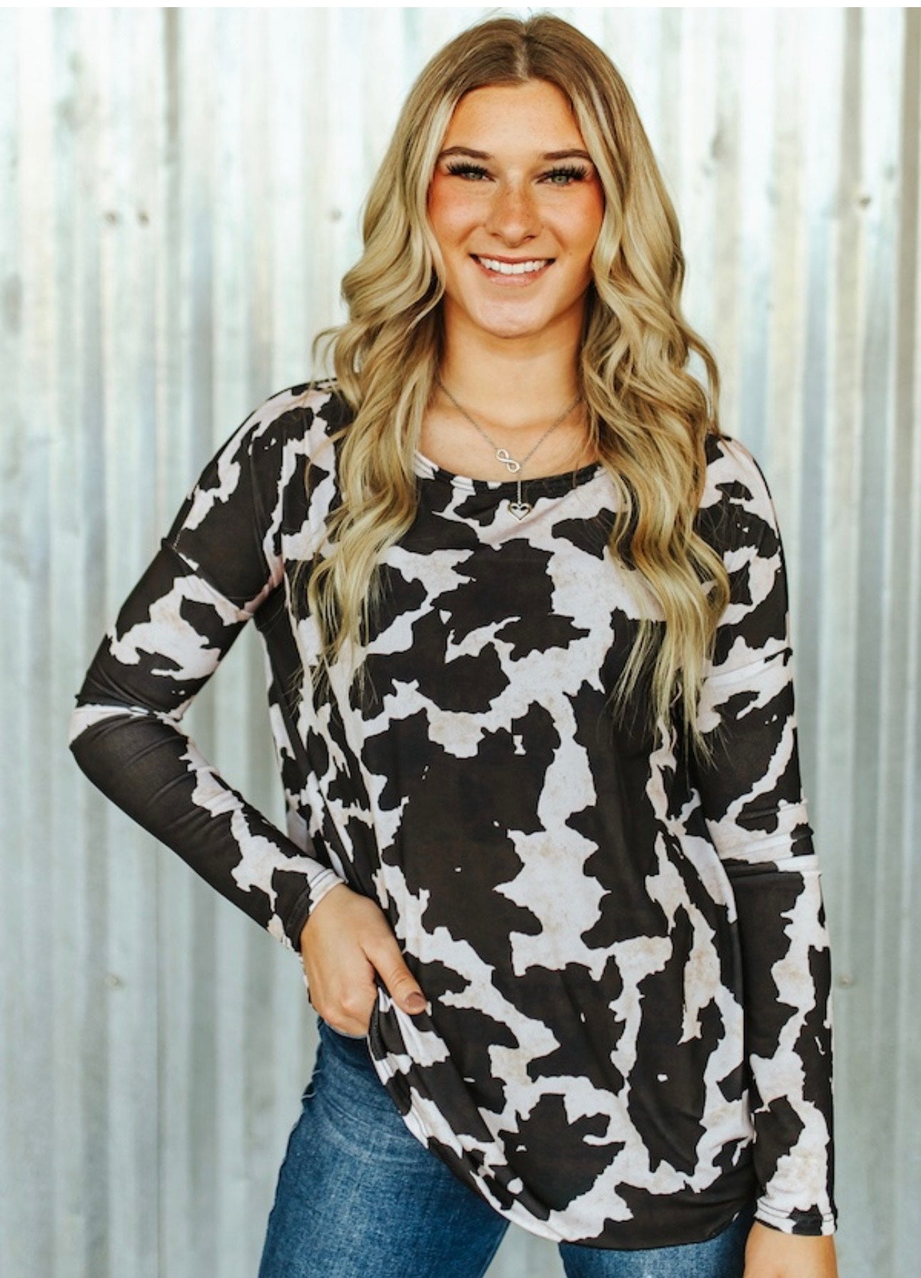 BLACK COW PRINTED DOLMAN TOP