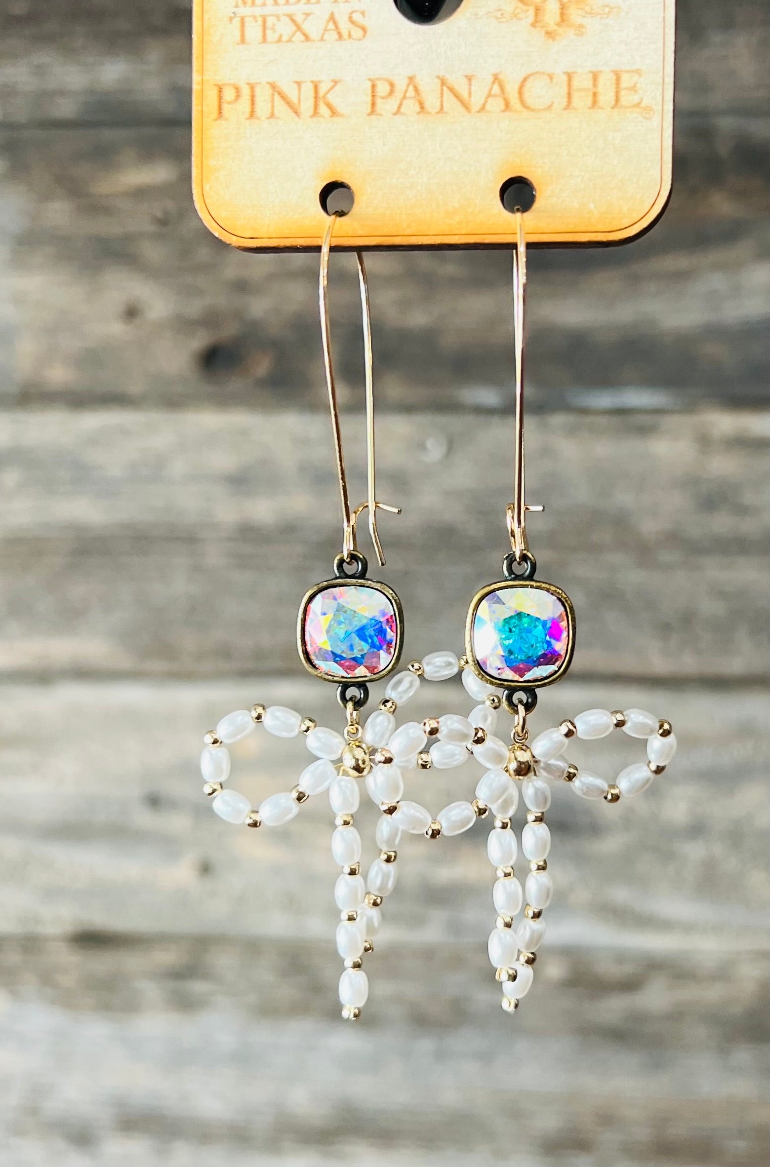 Dangling diamond and bow earrings